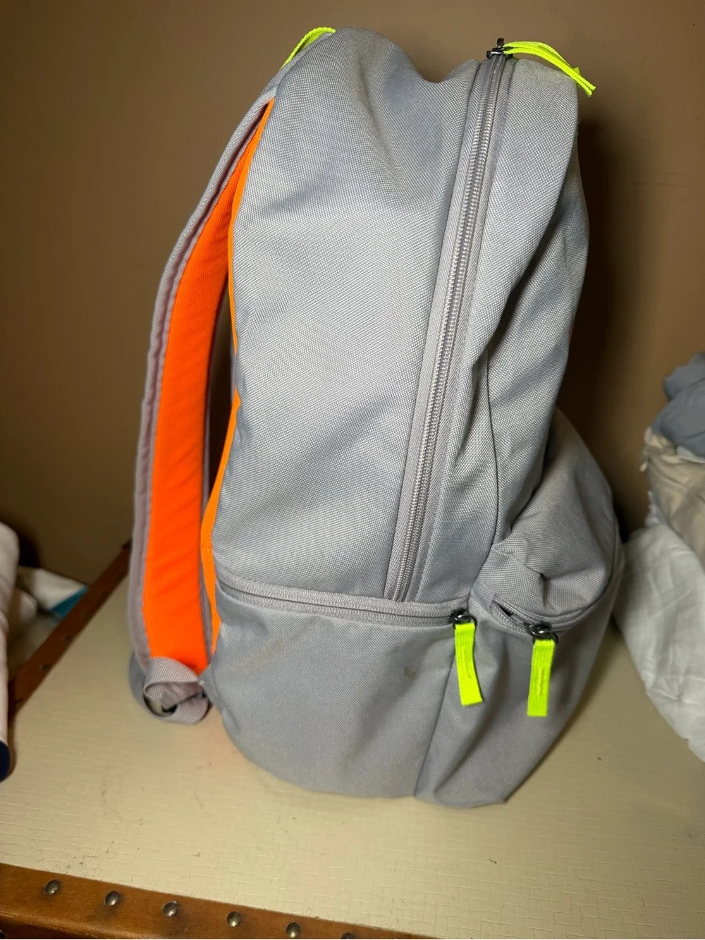 Nike Light Gray Backpack with Bright Orange Logo and Neon Accents